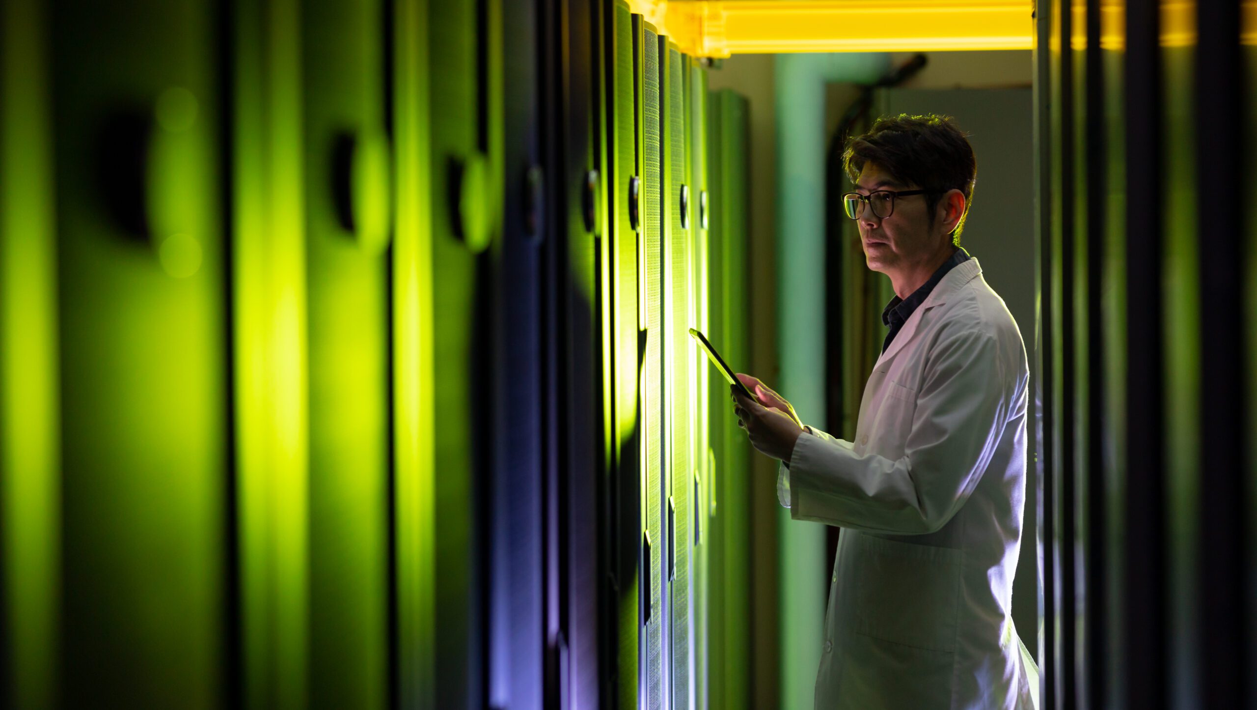 Technician working inside a data centre